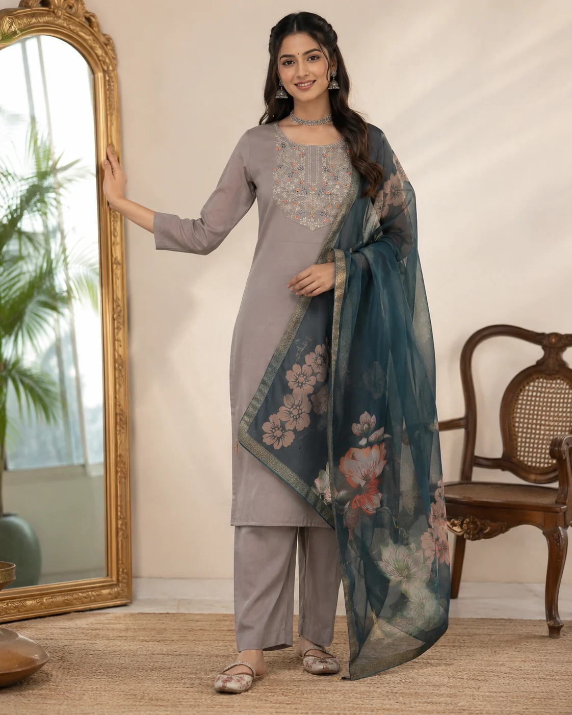 Woman wearing taupe grey embroidered 3 piece kurta set with matching trousers and teal floral organza dupatta — View 2
