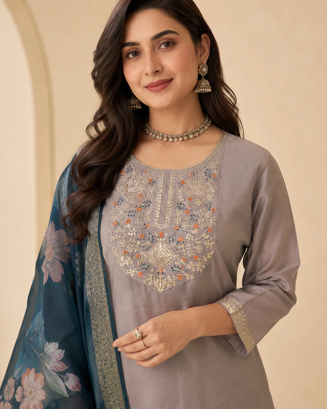 Woman wearing taupe grey embroidered 3 piece kurta set with matching trousers and teal floral organza dupatta — View 4