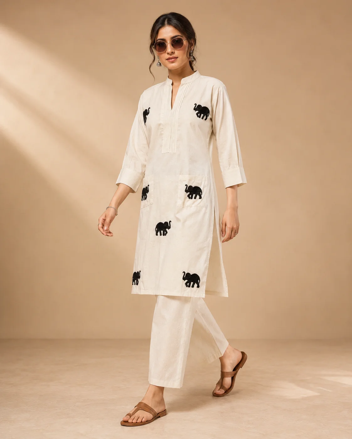 Woman wearing ivory Khadi Cotton co-ord set with black elephant embroidery — View 2
