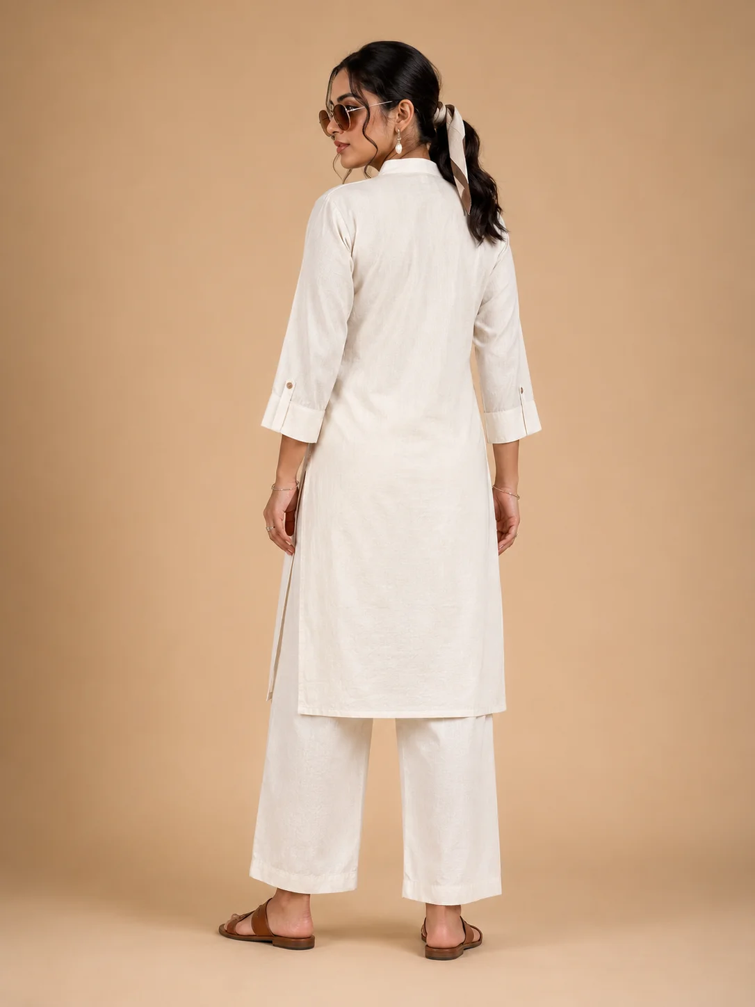 Woman wearing ivory Khadi Cotton co-ord set with black elephant embroidery — View 4