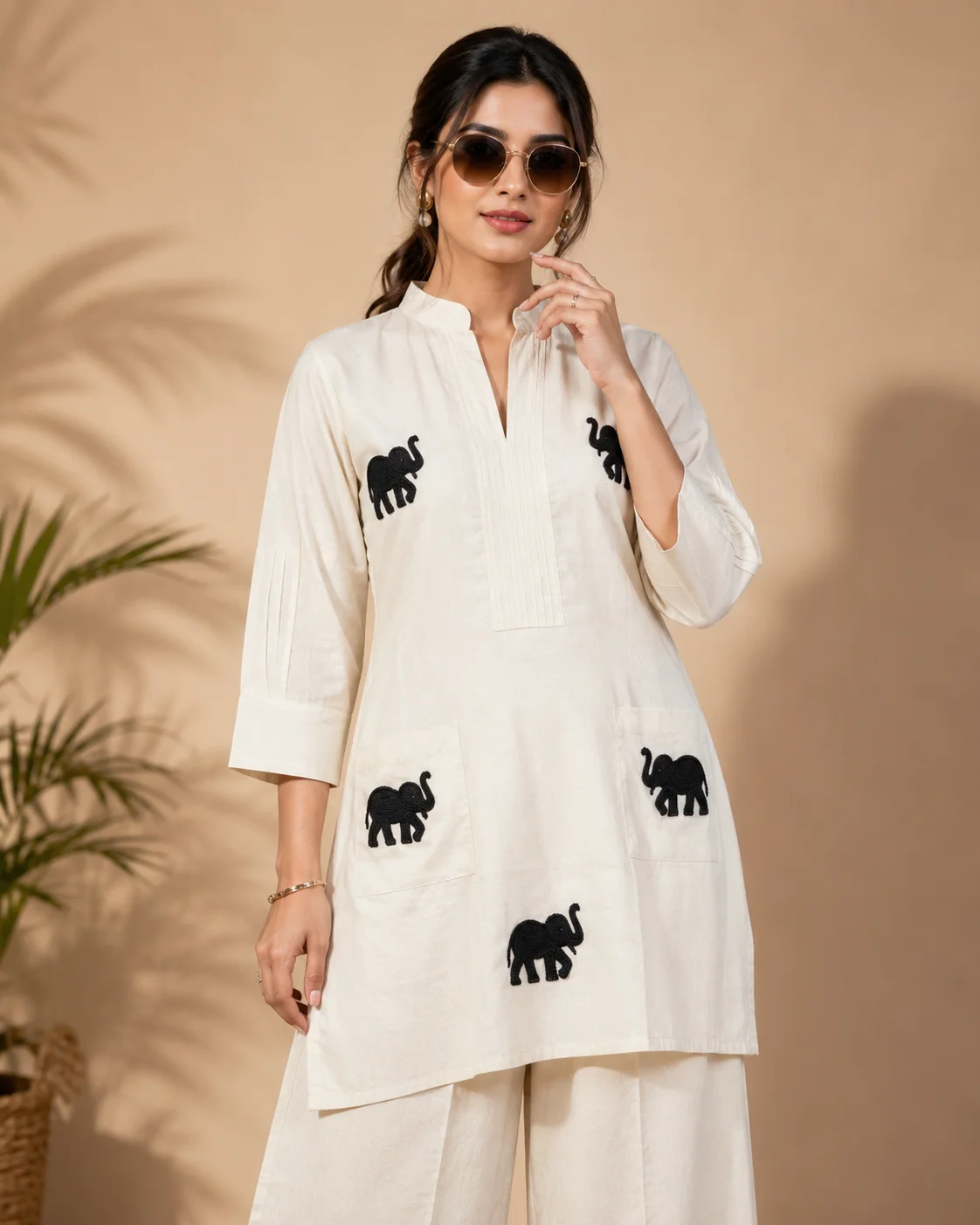 Woman wearing ivory Khadi Cotton co-ord set with black elephant embroidery — View 3