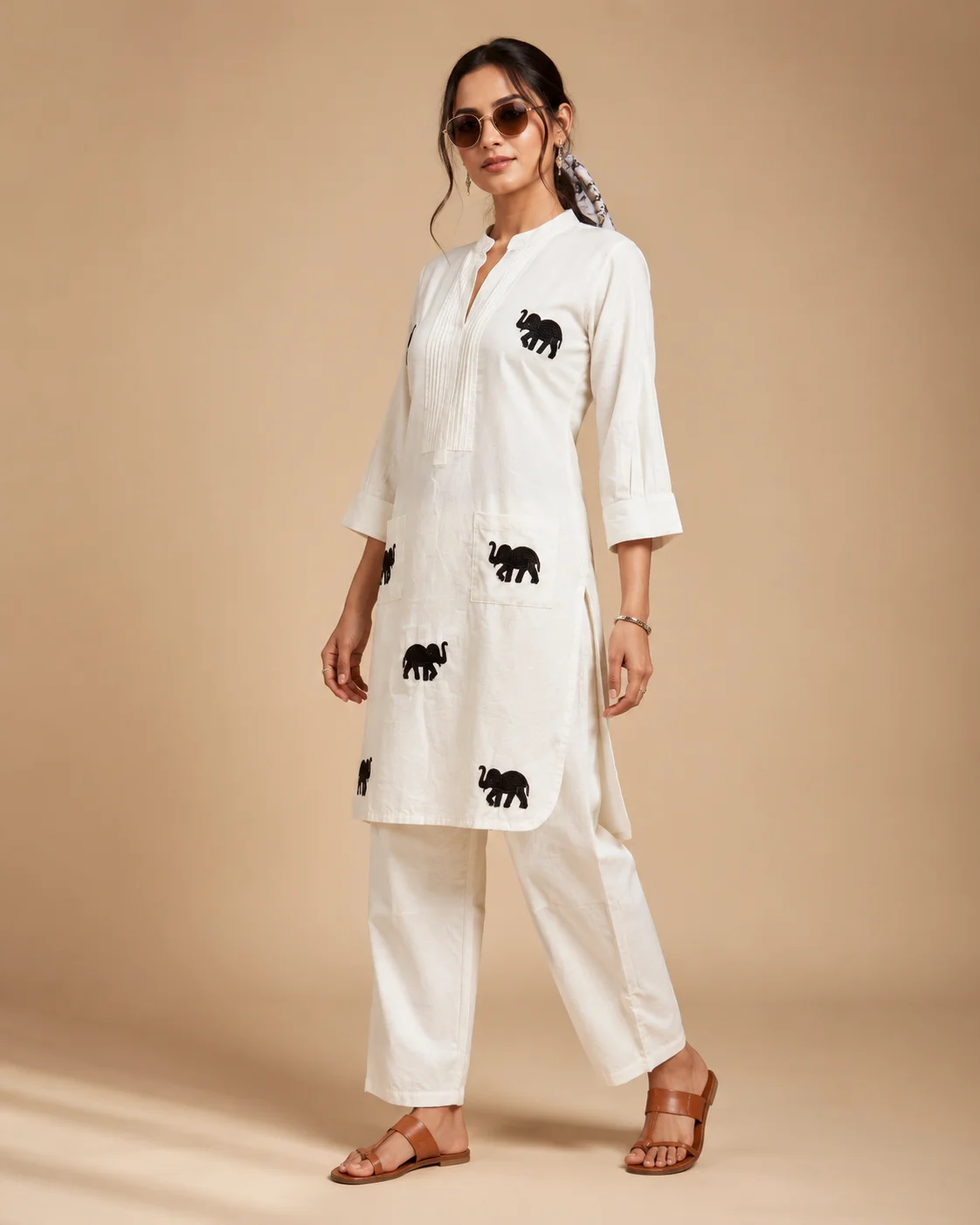 Woman wearing ivory Khadi Cotton co-ord set with black elephant embroidery — View 5